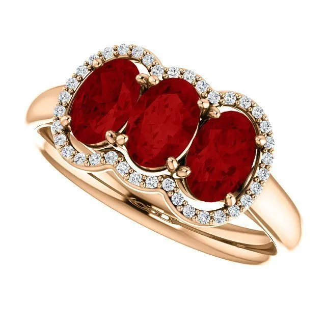 14KT GOLD 1.80 CTW RUBY & .10 CTW DIAMOND 3 STONE OVAL HALO RING