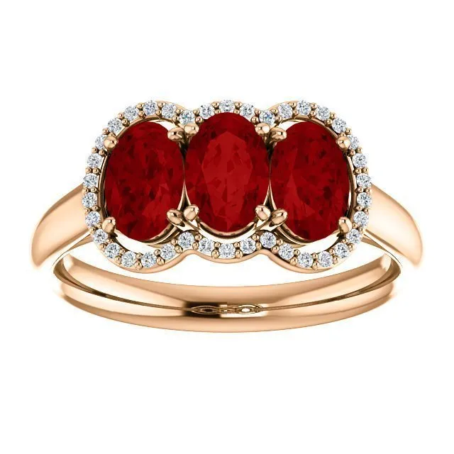 14KT GOLD 1.80 CTW RUBY & .10 CTW DIAMOND 3 STONE OVAL HALO RING