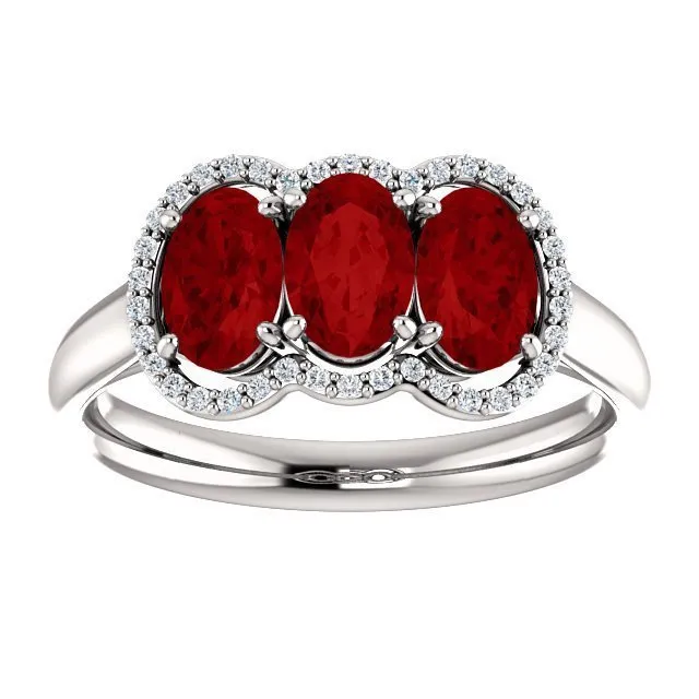 14KT GOLD 1.80 CTW RUBY & .10 CTW DIAMOND 3 STONE OVAL HALO RING