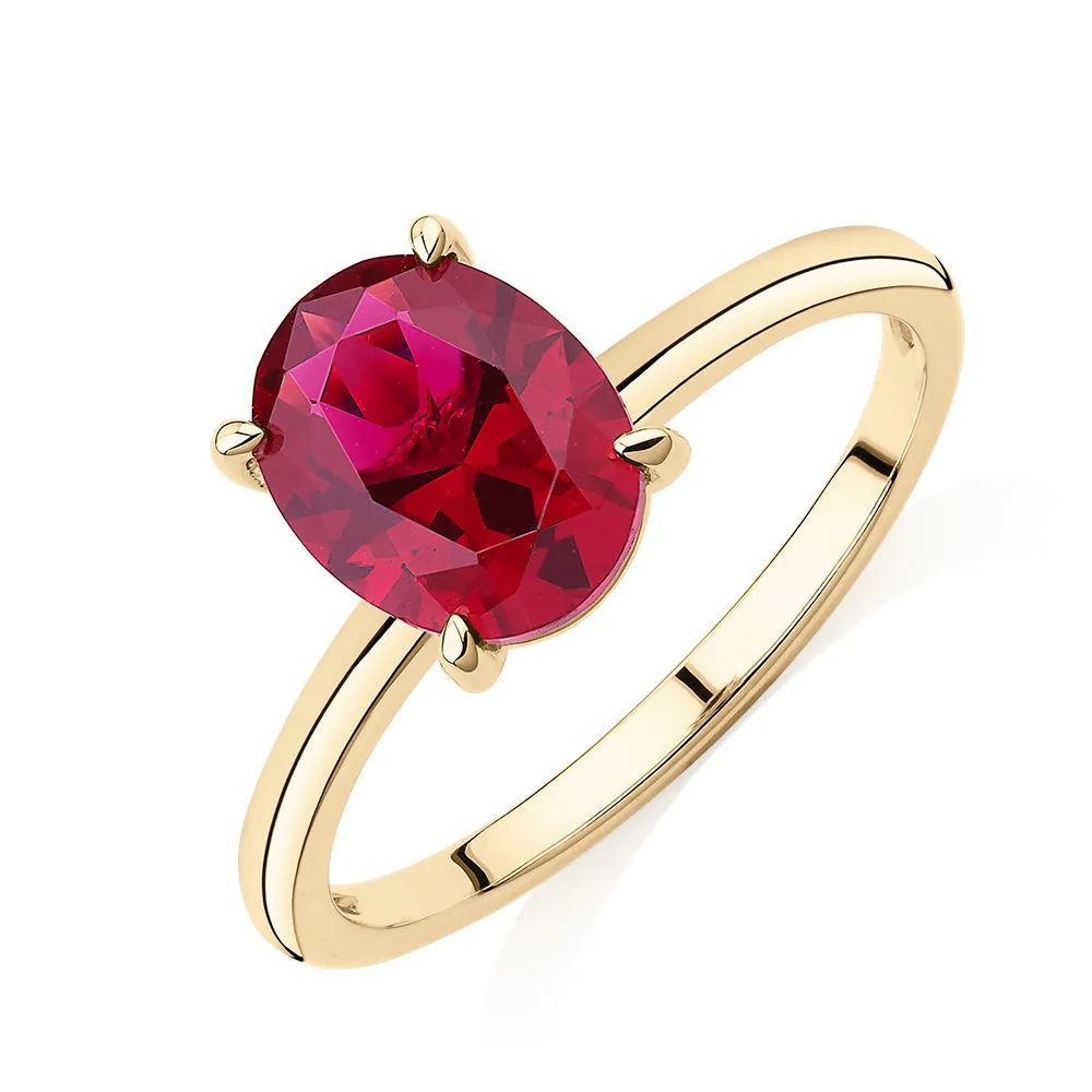 Dress ring with ruby simulant in 10 carat yellow gold