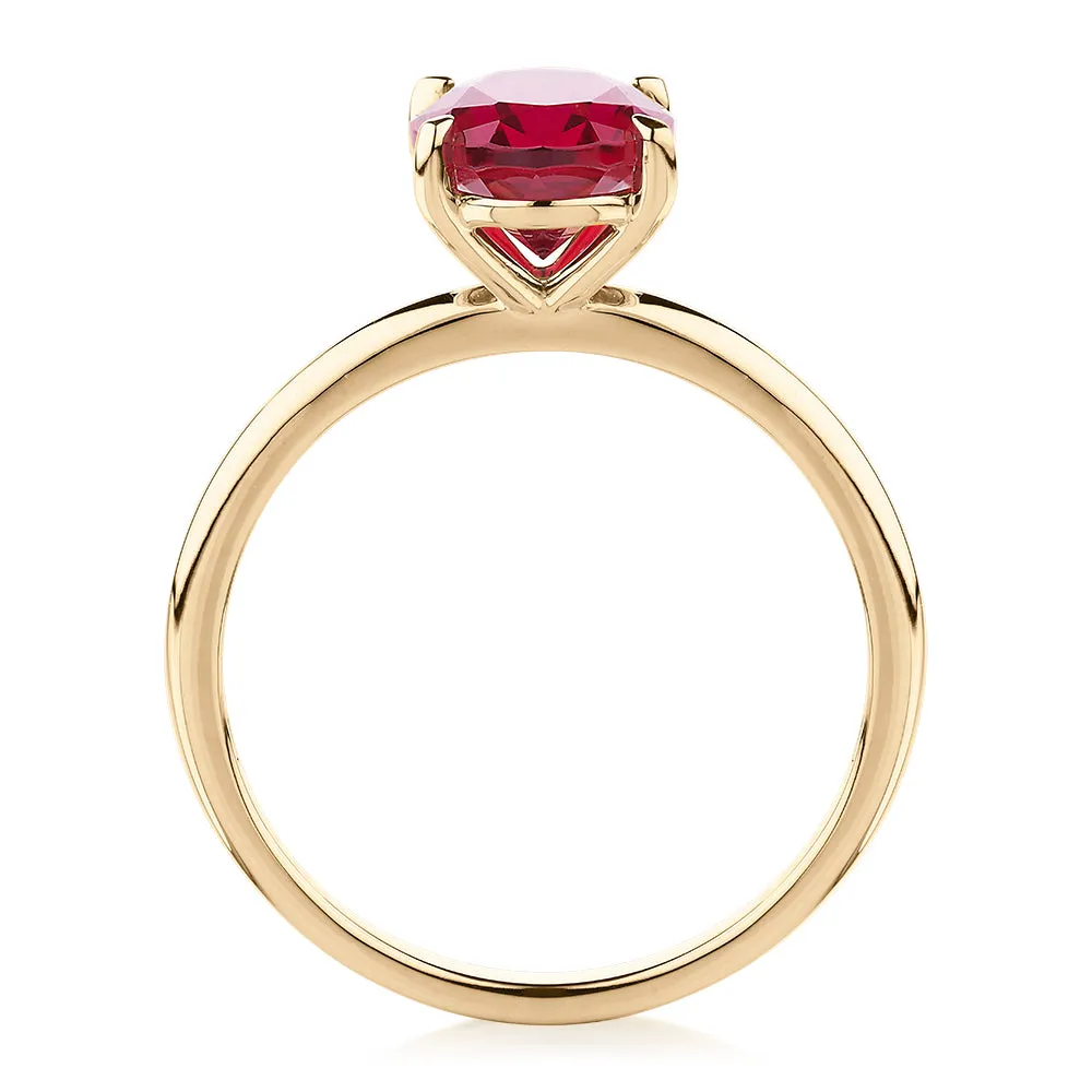 Dress ring with ruby simulant in 10 carat yellow gold