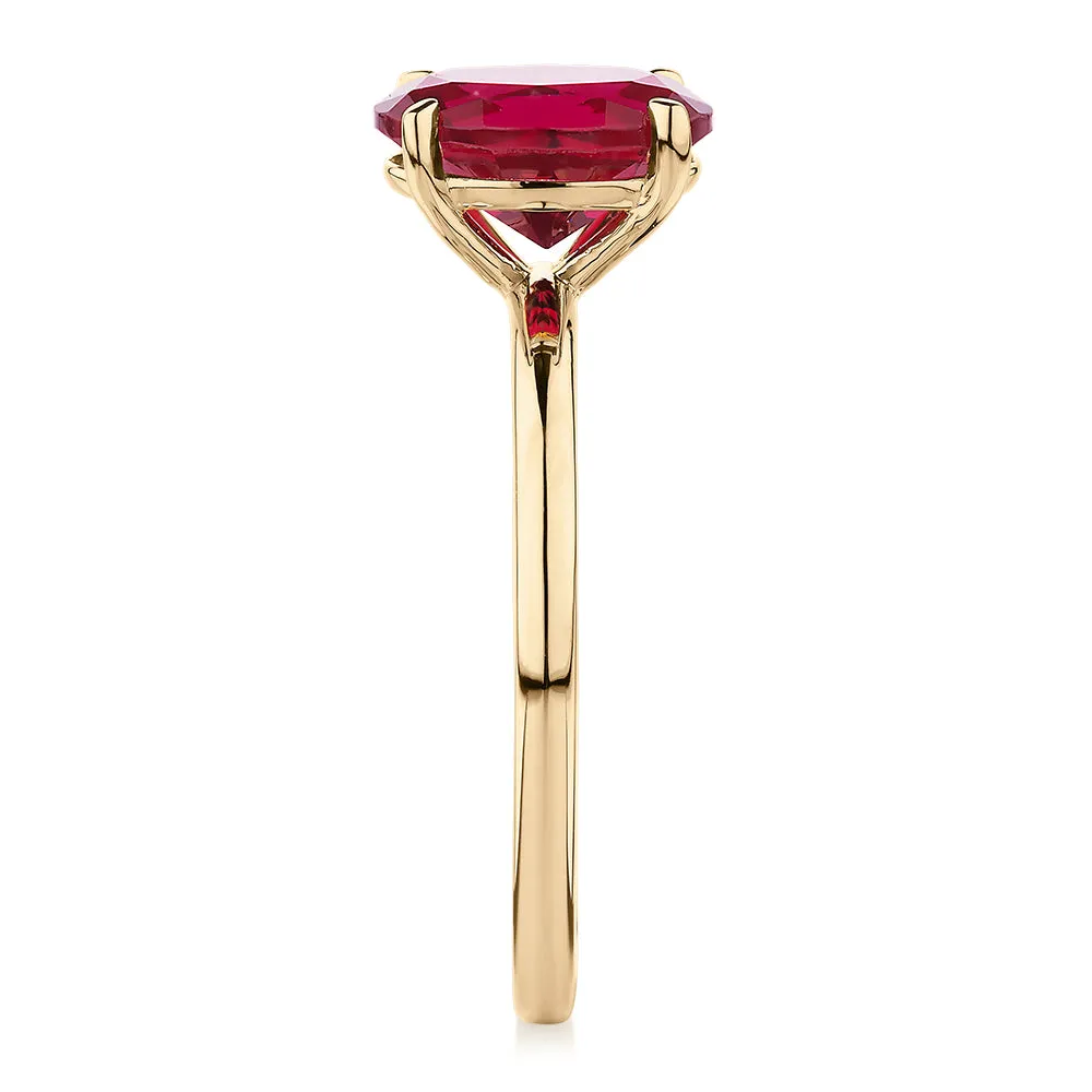 Dress ring with ruby simulant in 10 carat yellow gold